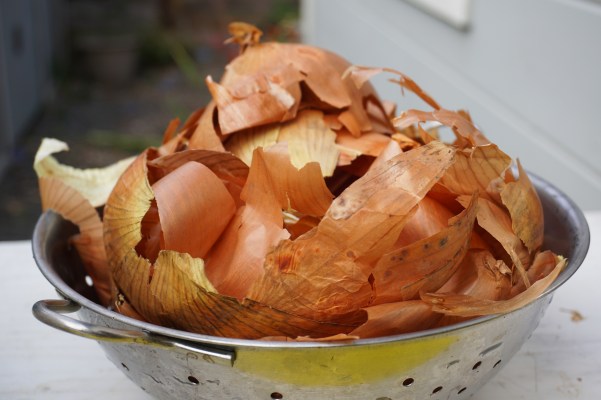 Collander full of yellow onion skins